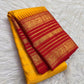 Grand arakku red zari pallu with intricate floral panels on manjal yellow vintage Kanchipuram Varisaipet saree