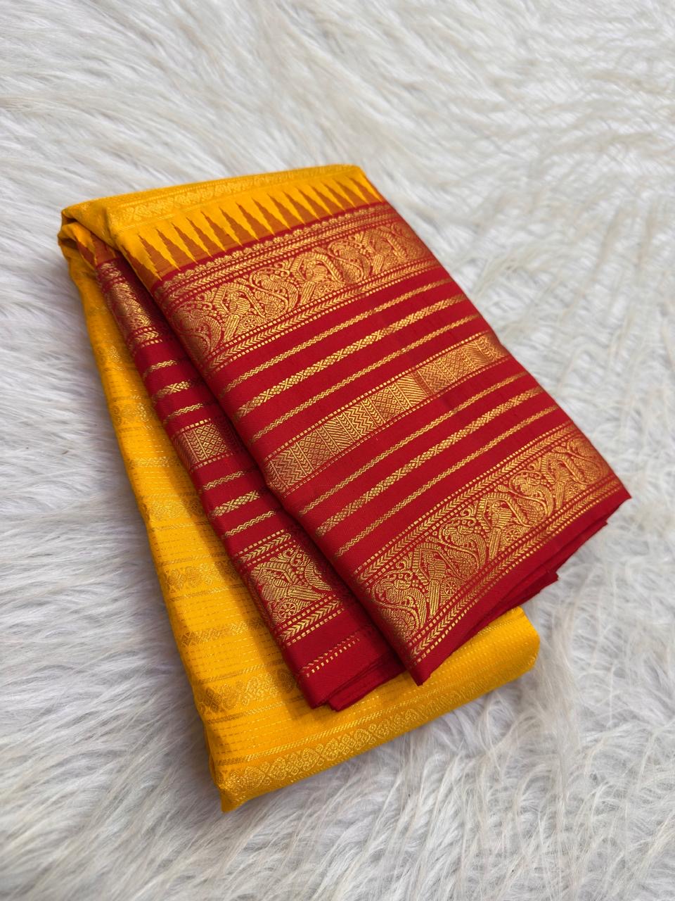 Grand arakku red zari pallu with intricate floral panels on manjal yellow vintage Kanchipuram Varisaipet saree
