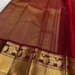Deep brown Vairaoosi Pure Kanchipuram Silk saree with arakku red border worn at a temple annadanam