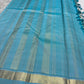 Warm ivory and Firozi blue slim-border Kanchipuram silk saree by Idam Living