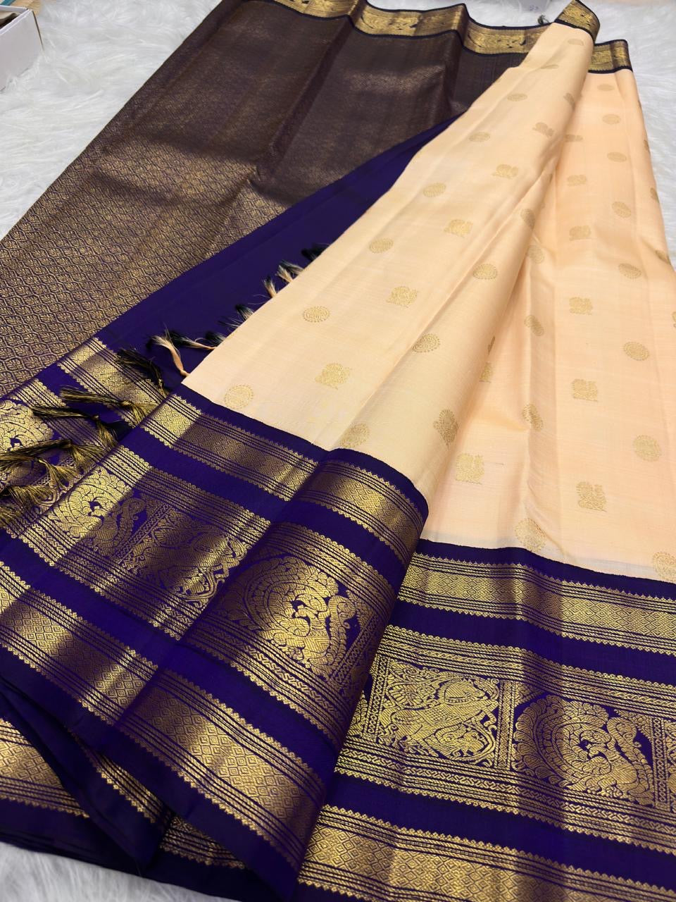 Pale Peach Pink & Deep Navy Blue Pure Kanchipuram Silk Korvai saree showing traditional handwoven body and richly detailed border.