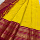 Ornate pallu and border of Turmeric Yellow & Arakku Red Varisaipet Kanchipuram silk saree with traditional zari and silk-thread work.
