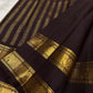 Deep plum Kanchipuram saree with a pallu of fine parallel gold zari lines