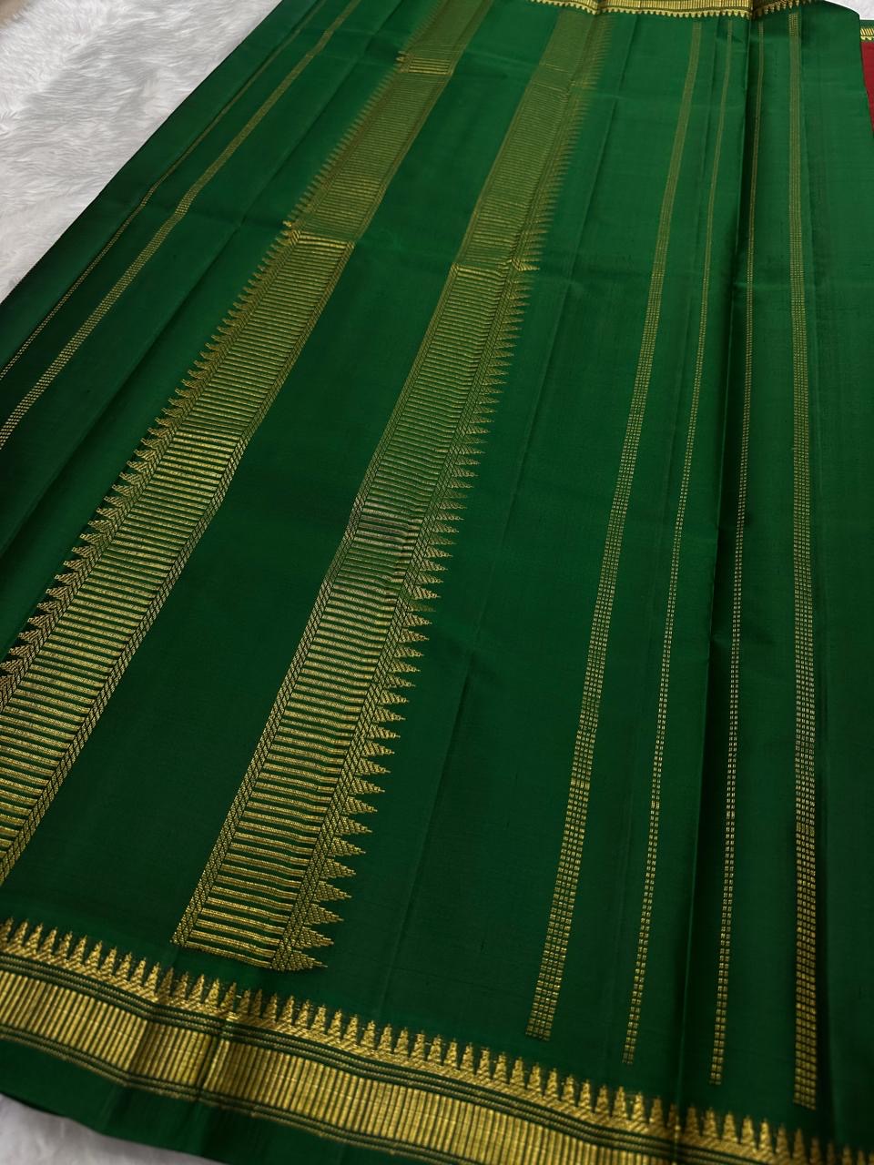 Ruby red pure silk saree with emerald green border and silk-thread detailing