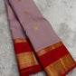 Kamalam floral motifs and scrolling Kodi vine zari border on Kanchipuram silk