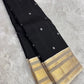 Black Kanjivaram silk saree ivory butta antique gold zari border korvai weave draped view