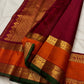 Warm ivory Kanchipuram saree opened to show zari twin bird buttas and rich contrasting border.