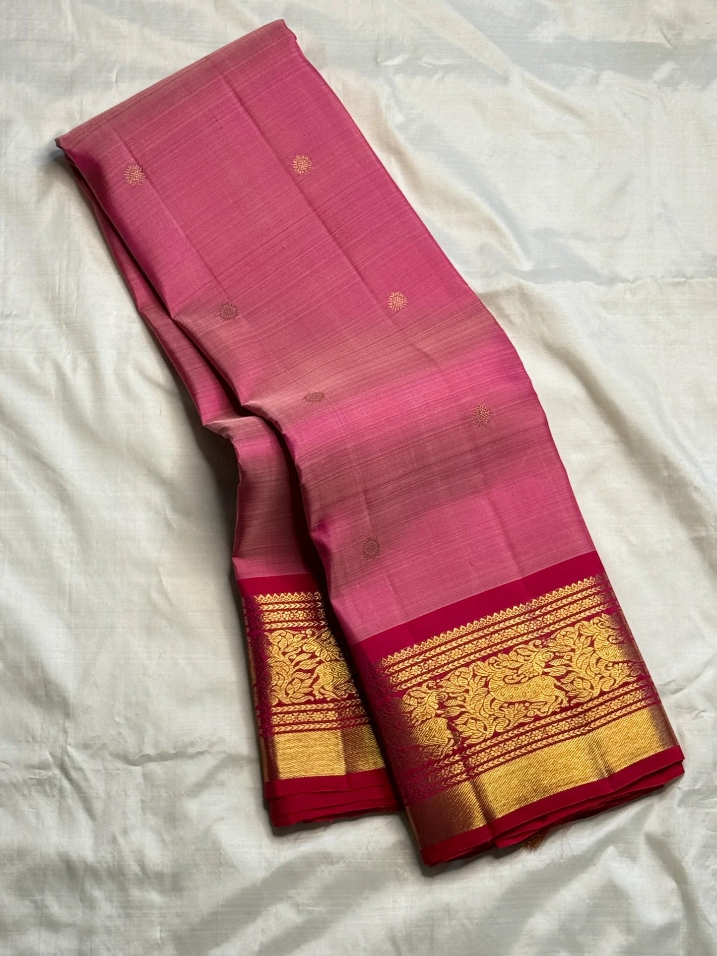 Rose pink pure silk Kanjeevaram Korvai saree with delicate zari buttas, full drape view