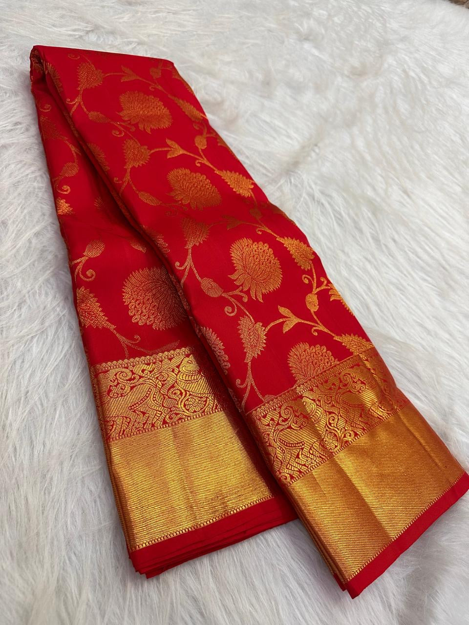 Vermilion red handwoven pure silk Kanchipuram saree with gold zari Banarasi-inspired floral jaal and yazhi border