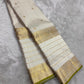 Ivory pure silk Kanchipuram saree, border selvedge detail with pearl ivory, pale gold and thulir-pachai fresh-green selvedge