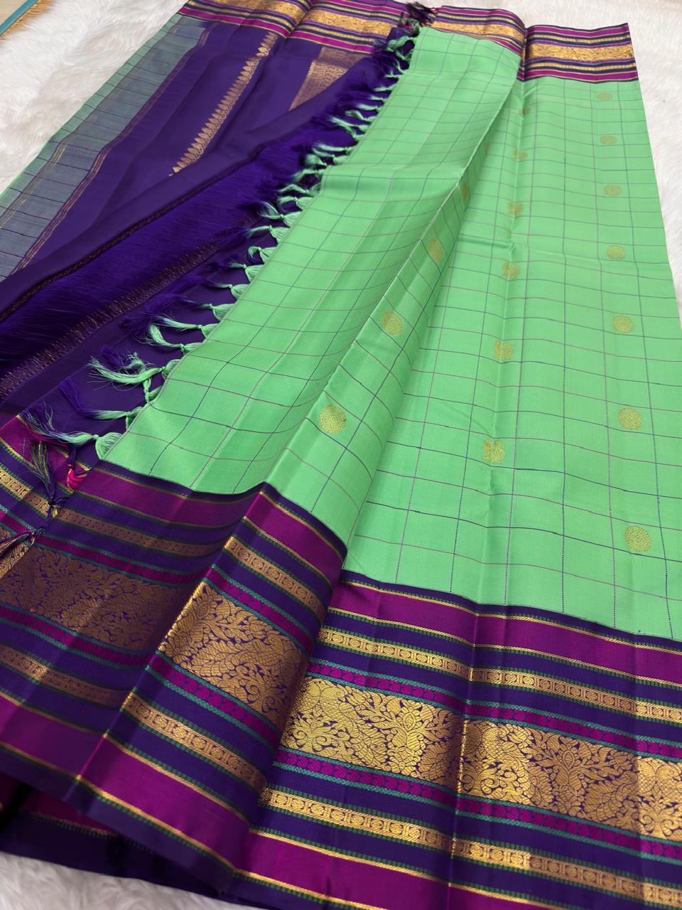 Kanjivaram pattu saree in aqua checks with varisaipet zari border and traditional gold detailing