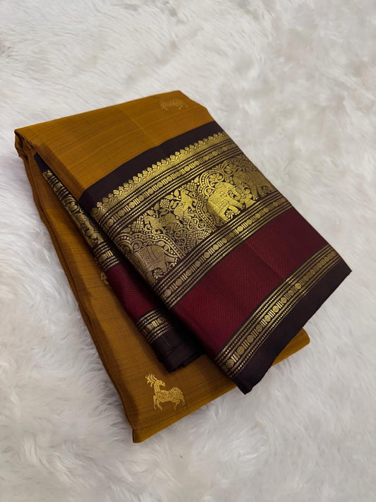 Ponvandu golden yellow Kanchipuram silk saree with crimson red border folded view