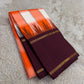 Kesari orange, ivory and coral-pink checked Kanchipuram pattu silk saree with purple border, styled for a sweet sixteen family party.
