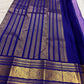 Lavender Oodha Pure Kanchipuram Silk saree with royal blue border worn at a temple kalyana utsavam