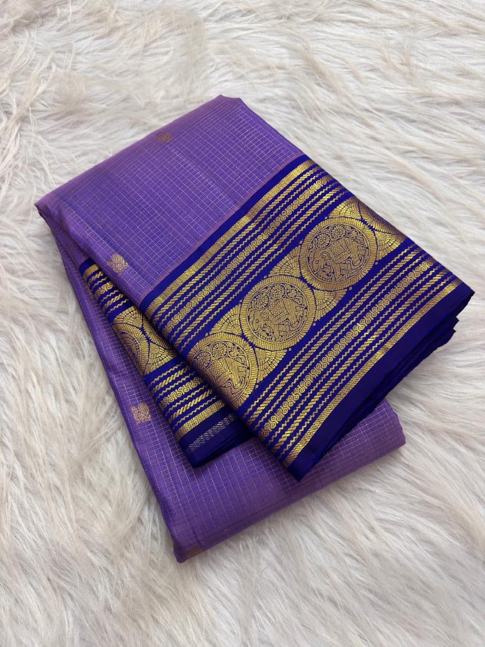 Lavender Oodha Kanchipuram Zari Kattam silk saree with royal blue Sorgavaasal Yaanai border at a temple Lakshmi homam