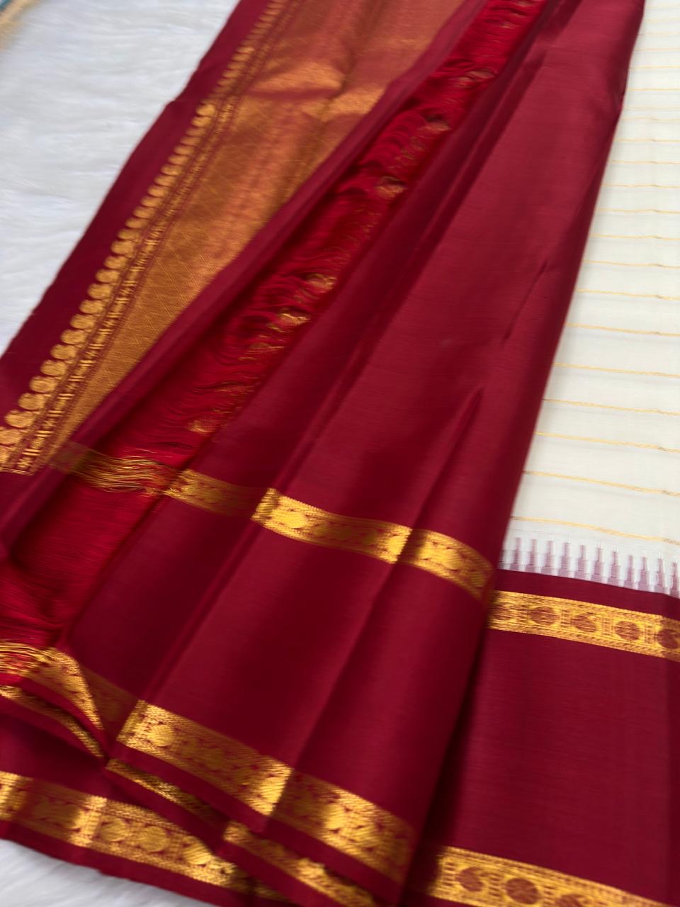 Ivory Gold Veldhari Korvai Kanchipuram pattu silk saree with arakku red and green border, styled for a Navagraha Homam.