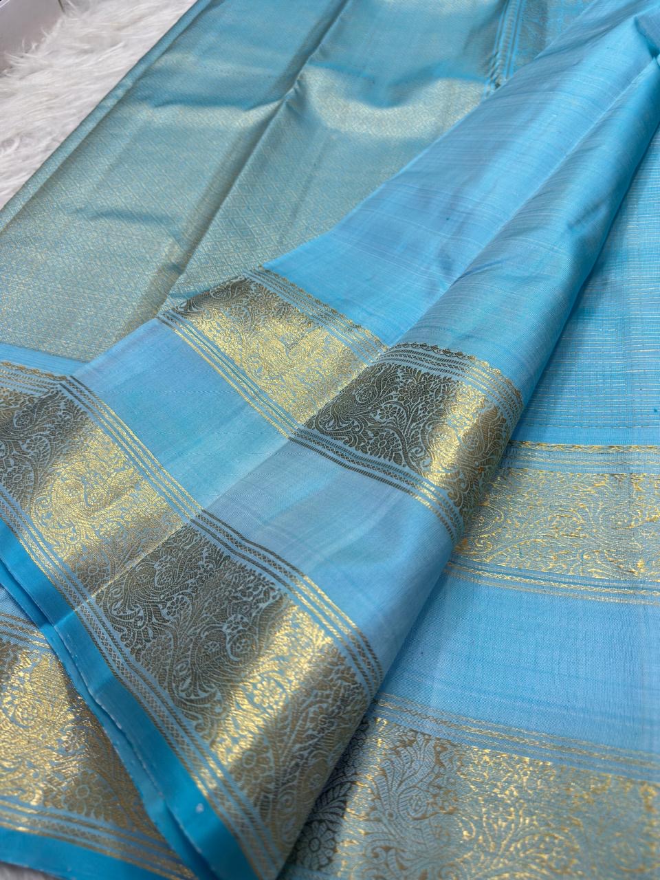 Sky blue and aqua vintage Kanchipuram Rettapet saree, blue silk body and small Annapakshi buttas, handwoven gold zari and traditional detailing