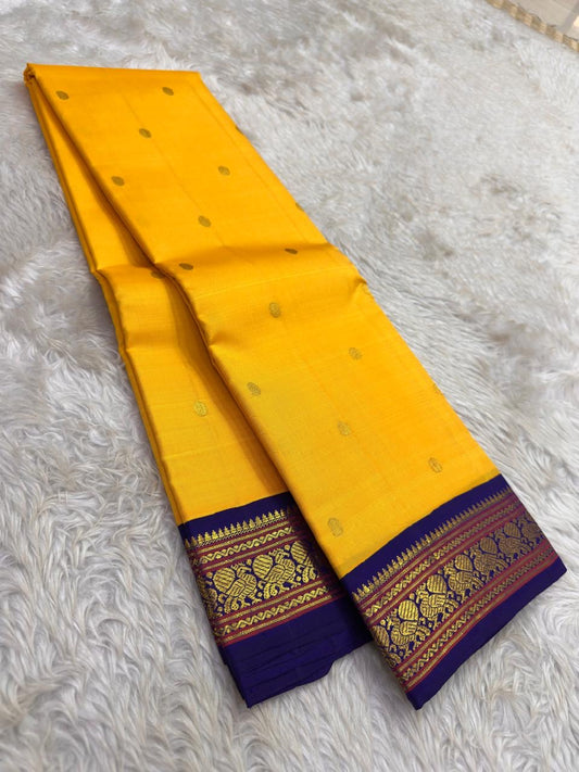 Turmeric Yellow and Deep Indigo Violet Korvai handwoven pure silk Kanchipuram saree, view 1 | Idam Living