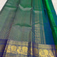 Peacock Blue, emerald green, royal blue and antique gold handwoven Kanchipuram butta silk saree, unfolded full view, with gold zari detailing.