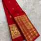 Kanchipattu silk saree in vibrant kumkum red with antique gold border Vanasringaram weave traditional zari detail