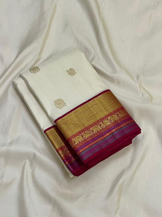 Pure Kanchipuram silk saree with yaanai and mayil butta motifs in antique gold zari on an ivory silk body with pink accents