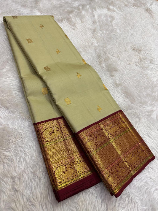 kanjivaram silk saree sage body red border zari detailing close up
