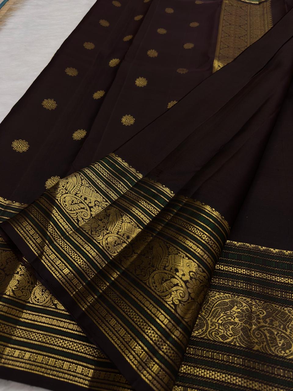 Coffee brown pure silk Kanchipuram saree with antique gold mayil chakram buttas, deep green accents, and a detailed peacock and arai maadam pallu, view 5.