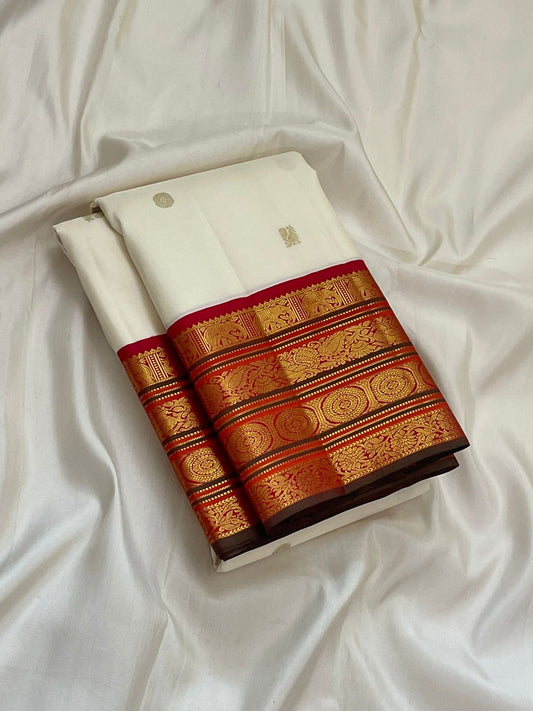 Pure Kanchipuram silk saree in ivory with traditional gold zari varisaipet border woven on deep red silk