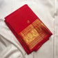 Vermilion red, warm Arakku-red undertones and rich yellow gold handwoven Kanchipuram butta silk saree, body silk detail, with gold zari detailing.