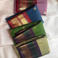 Emerald green and aubergine-purple Vanasringaram peacock border on leaf green Kanjivaram saree