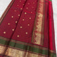 Deep forest green and raspberry-red Vanasringaram peacock border on dusty lavender Kanchi Pattu saree