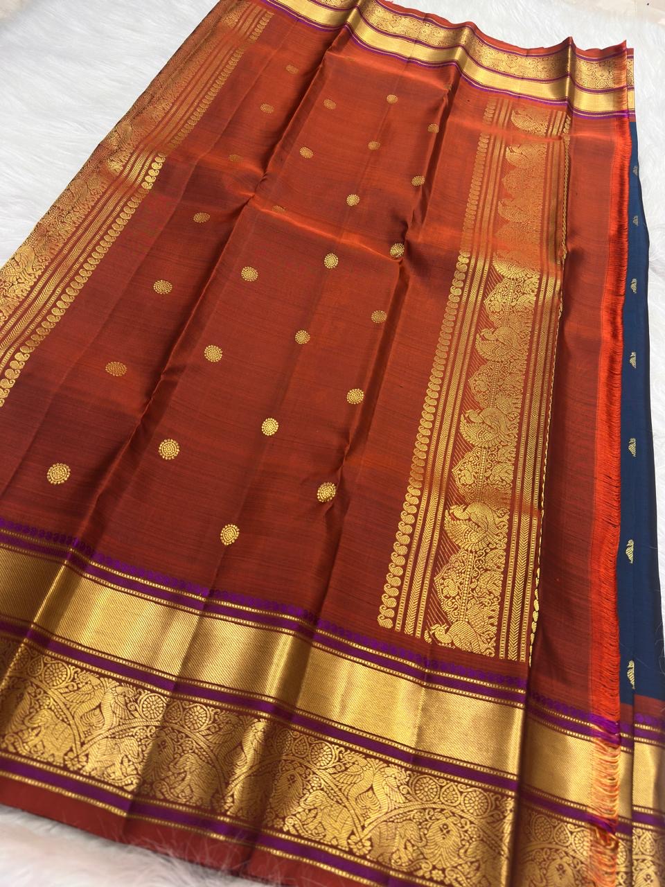 Richly ornamented zari pallu detail on peacock blue pure silk Kanchipuram saree