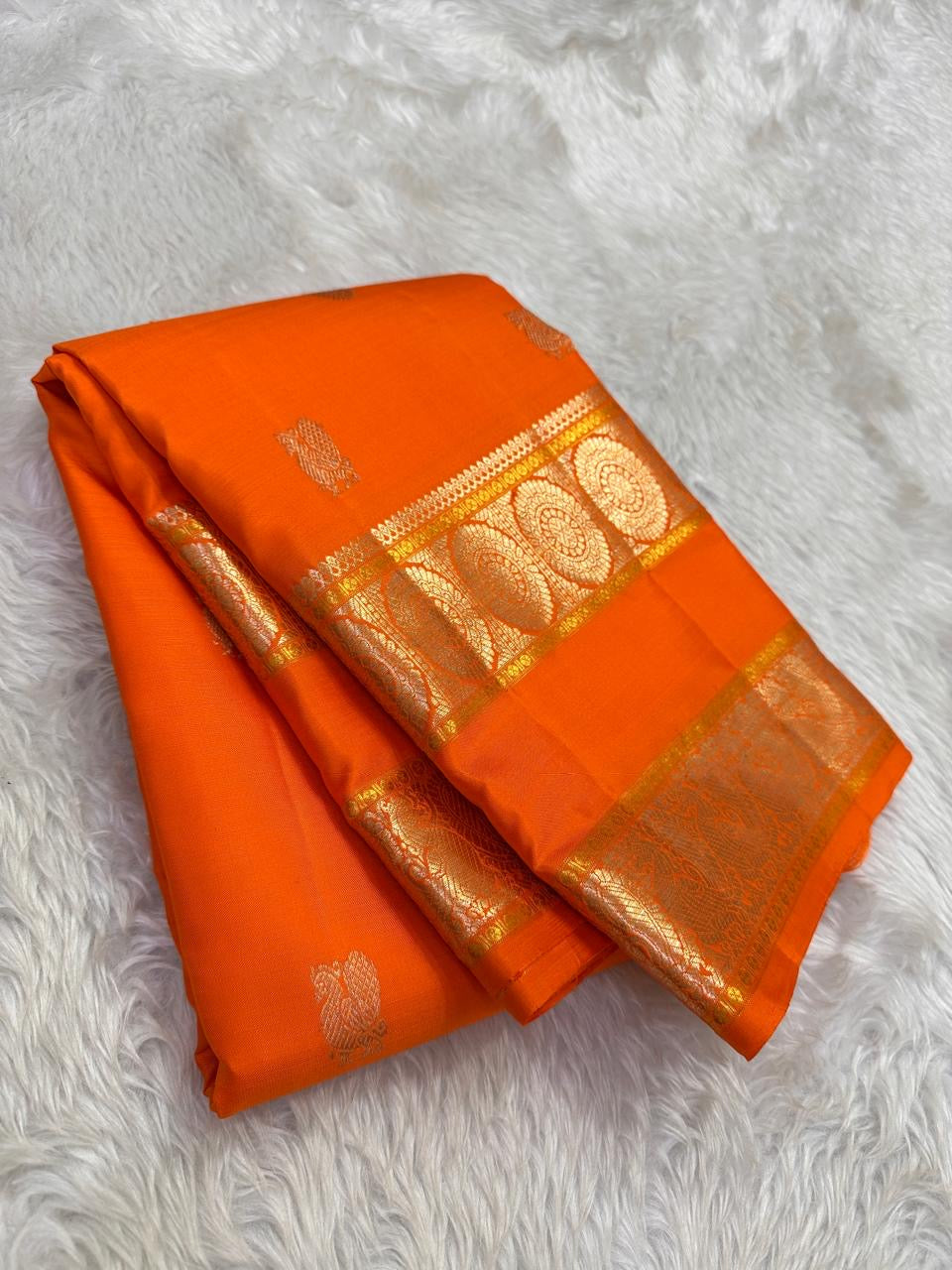 rt pallu detail of amber flame Kanchipuram silk saree