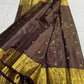 Kanchipattu silk saree with antique gold pallu and brown silk body closeup