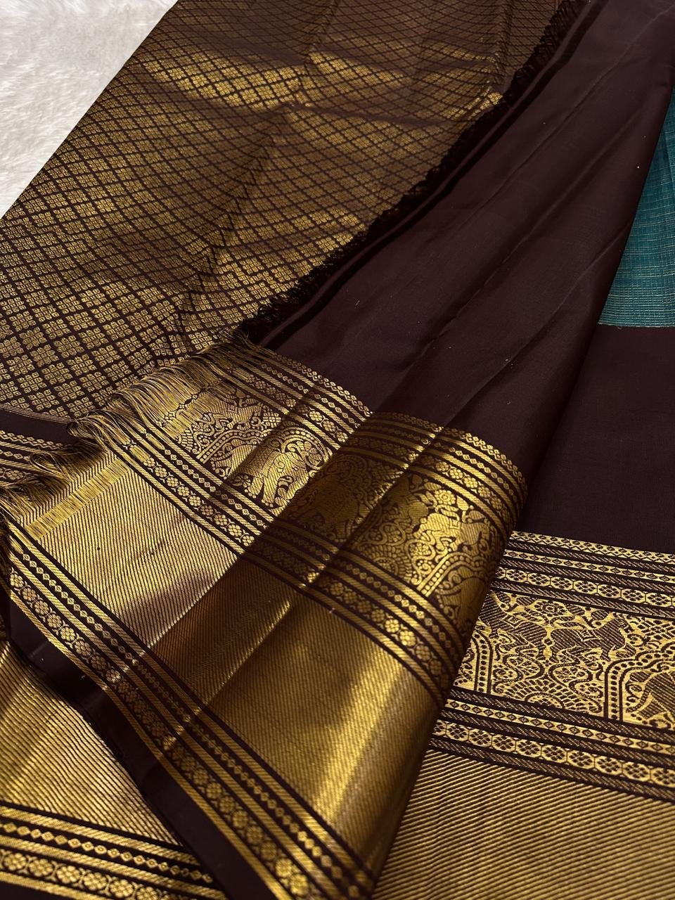 Traditional Kanchipuram silk saree pallu with intricate zari weaving