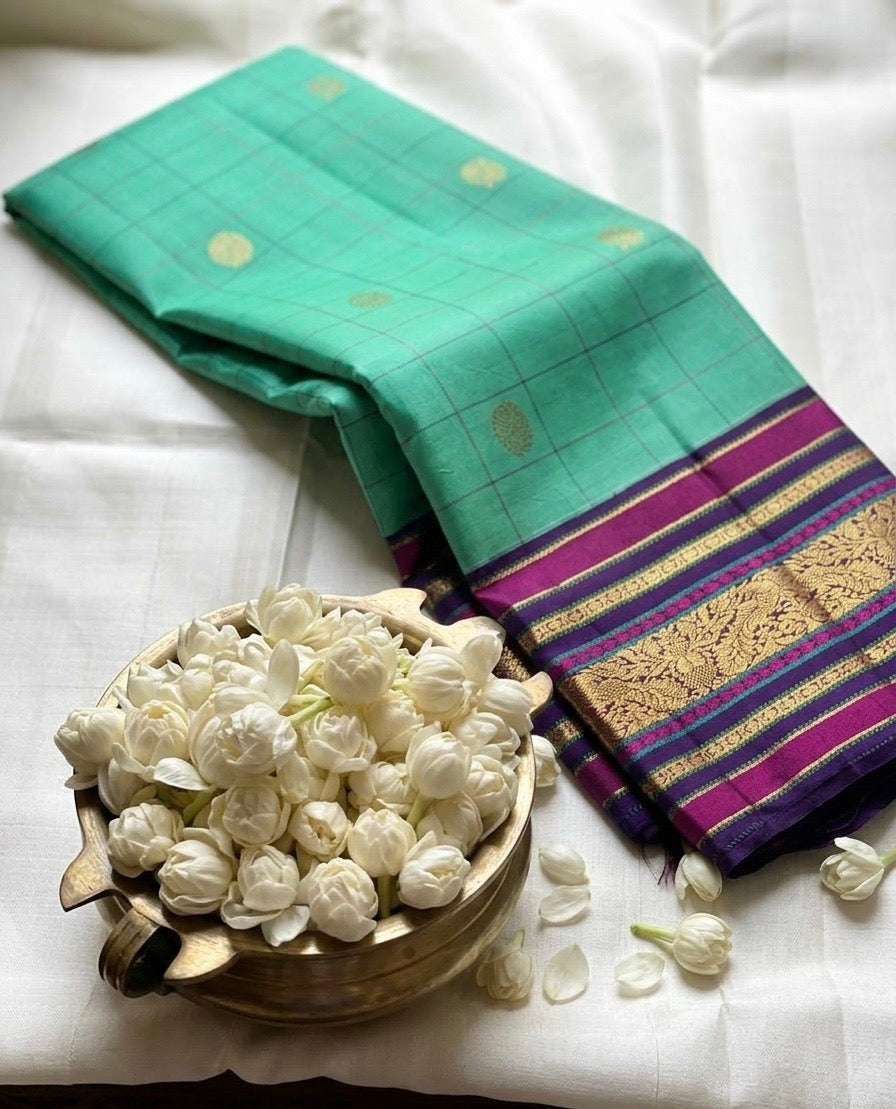 Aqua Kanjivaram silk saree with structured grid pattern and deep plum zari woven border detail