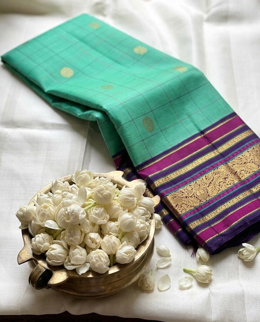 Aqua Kanjivaram silk saree with structured grid pattern and deep plum zari woven border detail