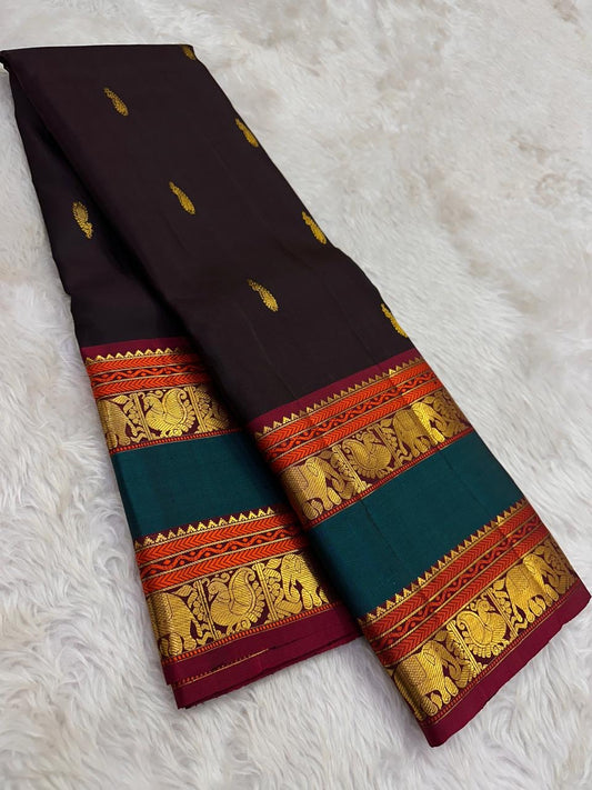 Coffee brown Kanchipuram silk saree with peacock green border folded view