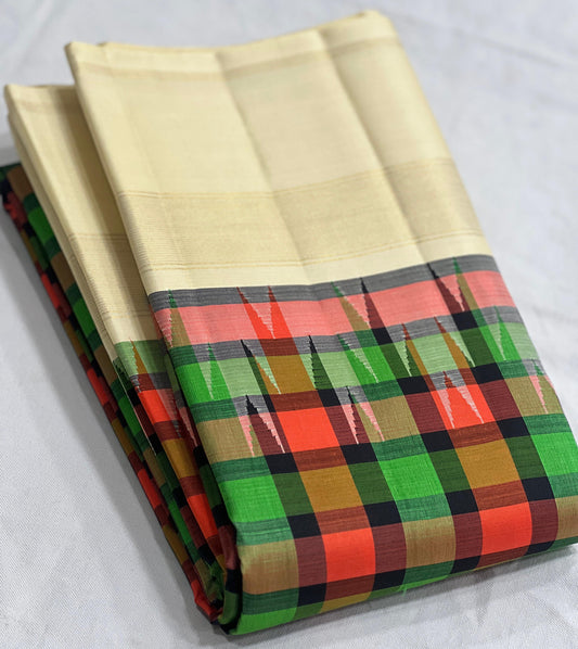 buttercream kanchipuram silk saree with green checks folded view