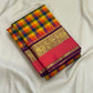 Folded pure Kanchipuram silk saree with multicolor checked body and purple border featuring gold zari weaving