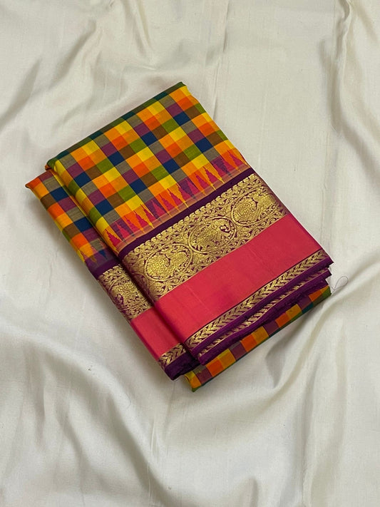 Folded pure Kanchipuram silk saree with multicolor checked body and purple border featuring gold zari weaving