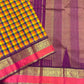 Detailed view of multicolor checked handloom silk body transitioning into purple border with gold zari