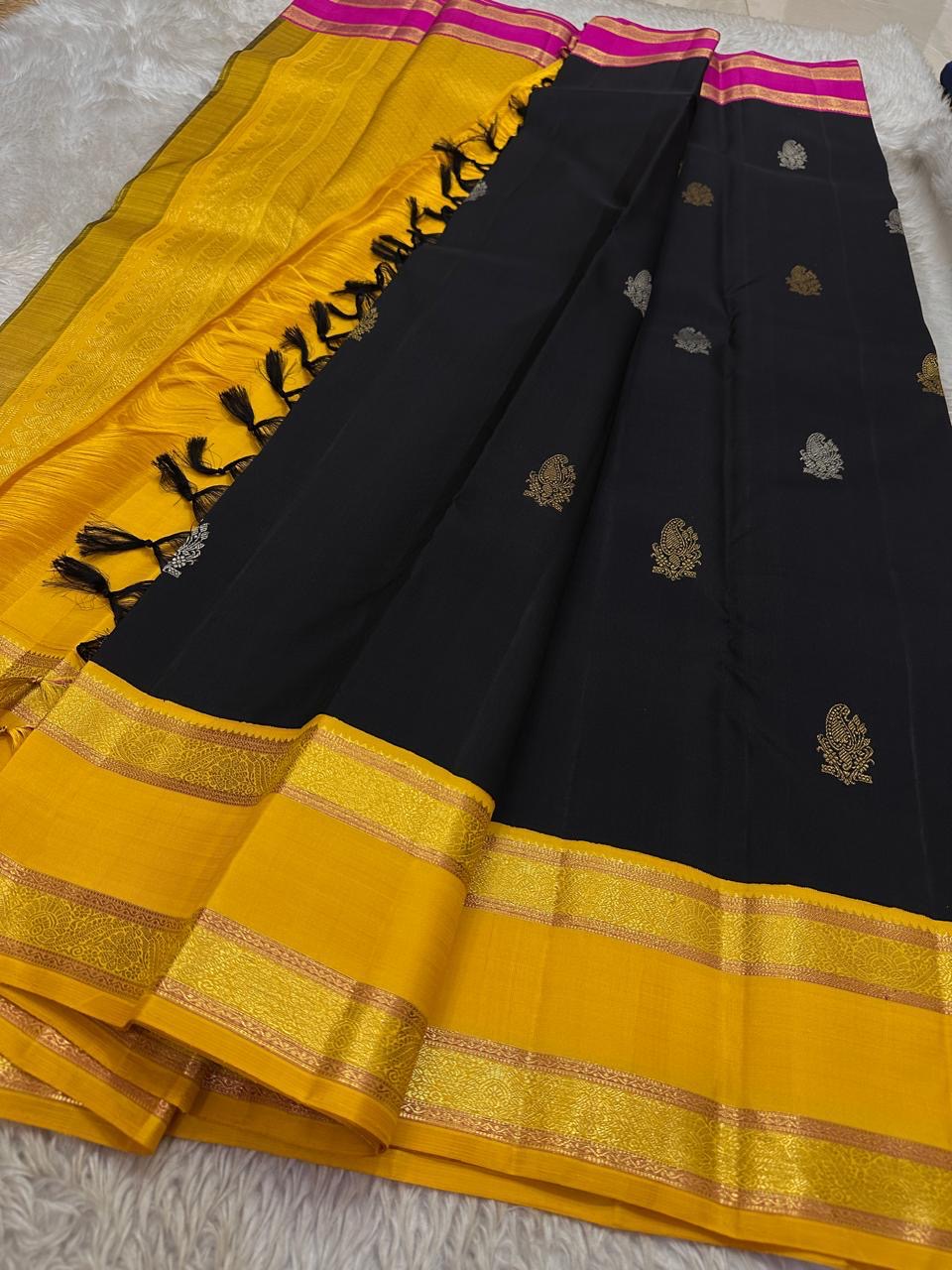 Pure Kanchipuram silk saree in deep navy with mustard gold zari border and pink contrast pallu