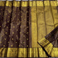 Kanjeevaram silk saree with linear zari texture and rich gold pallu detail