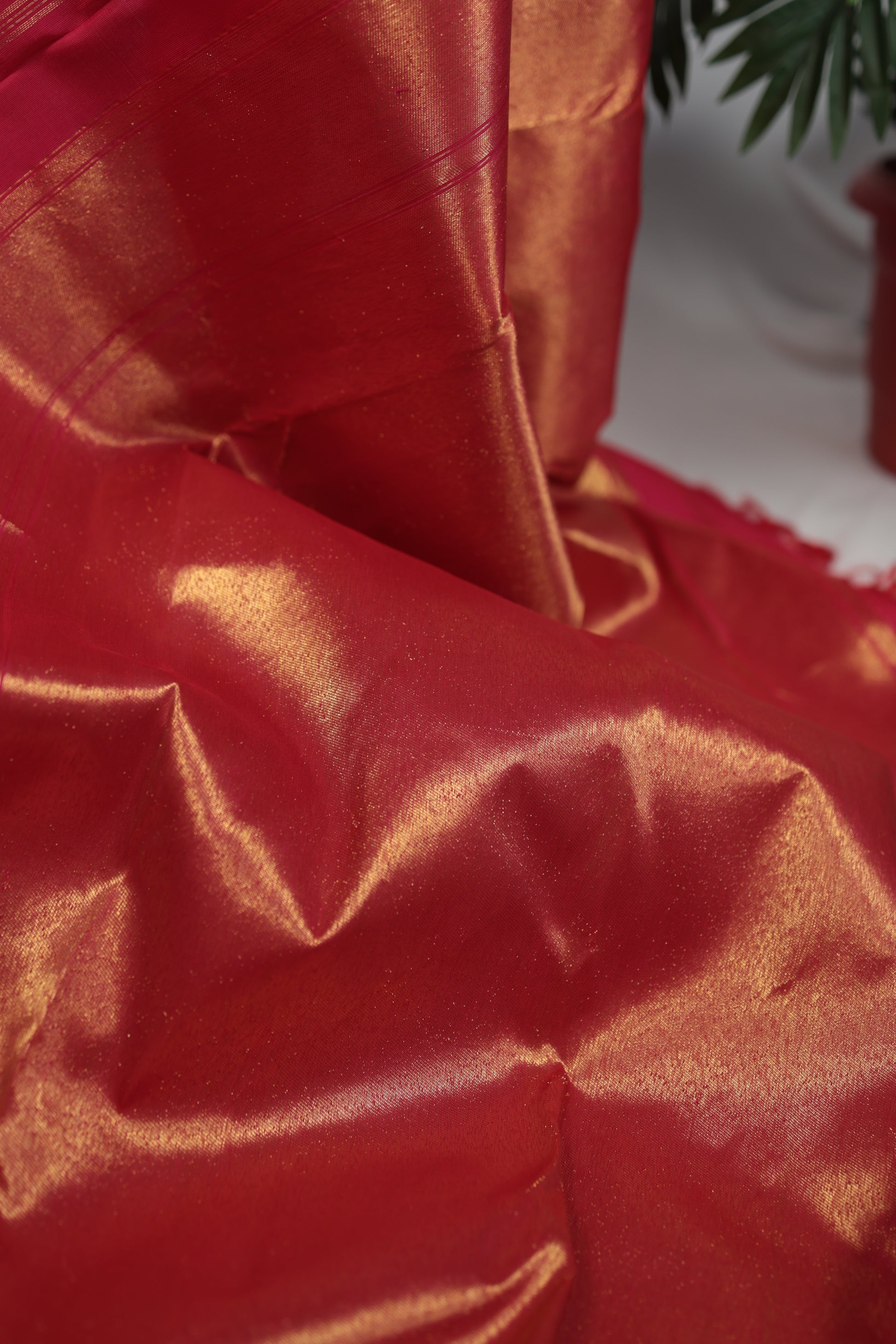 Draped Pure Kanchipuram silk saree with Ettukol weave and antique gold zari accents highlighting the depth and craftsmanship of South Indian handloom weaving