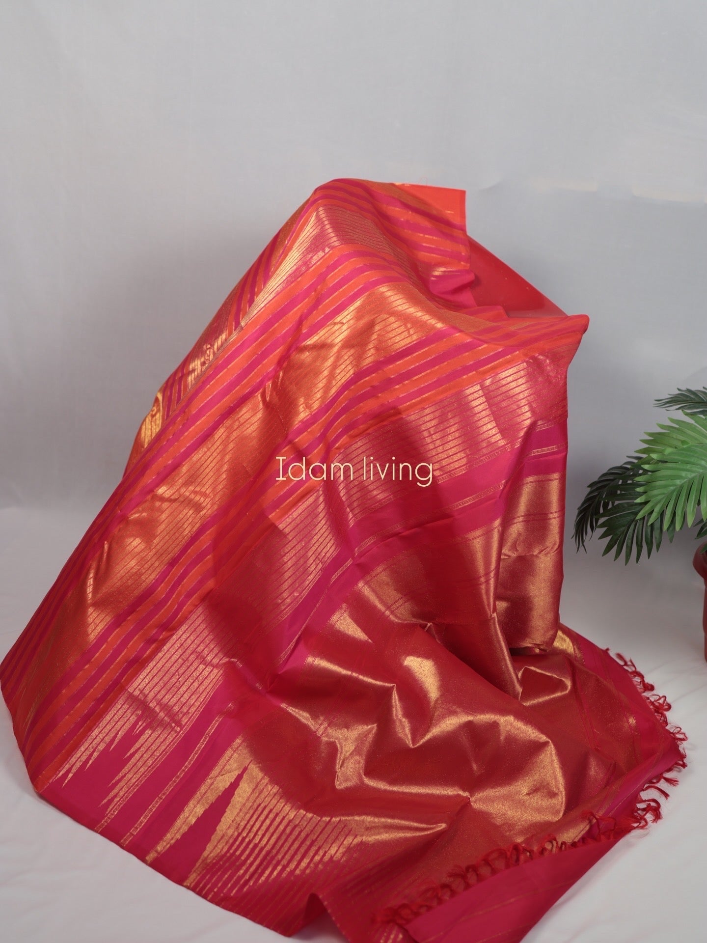  Front drape view of Pure Kanchipuram silk saree with Ettukol weaving and antique gold zari showing the silk sheen and structured weave pattern