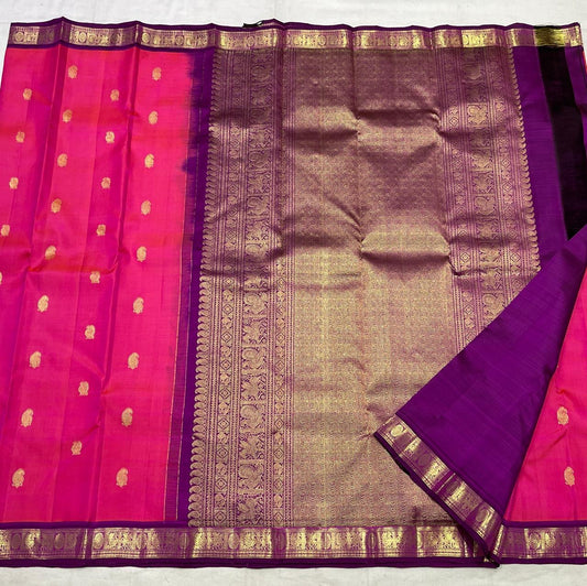 Kanjivaram silk saree pink body with royal purple border draped view