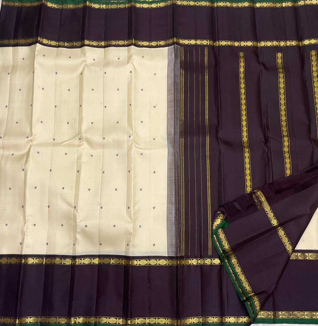 White Kanchipuram silk saree border detail with purple band and green selvedge