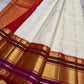 Wide view of the red pallu with gold zari motif grid and ornate zari border detailing, available in the USA.