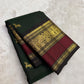Deep green Kanchipuram silk saree with mahogany red border folded view
